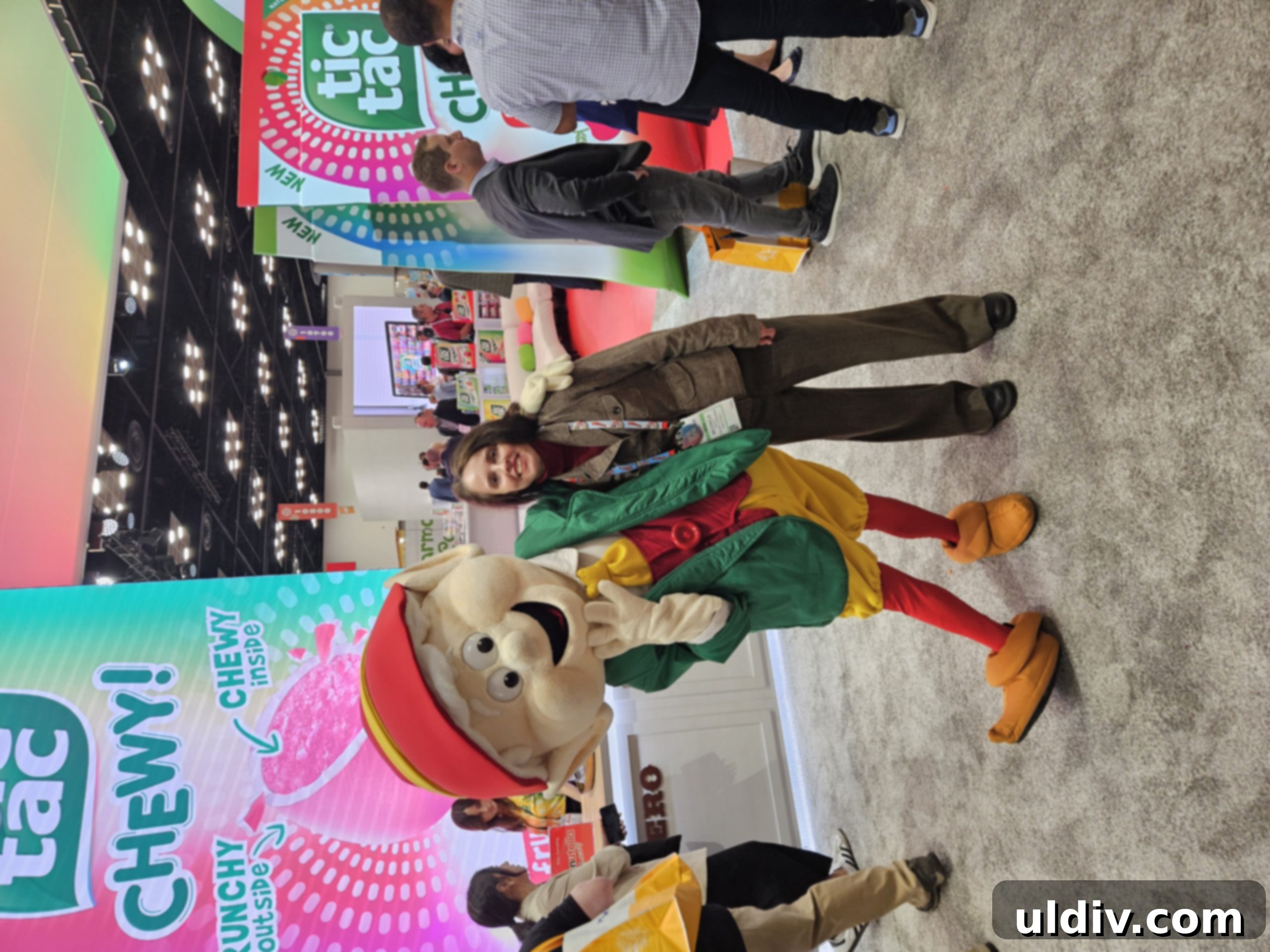 Smiling person enjoying sweets at the Sweets & Snacks Expo