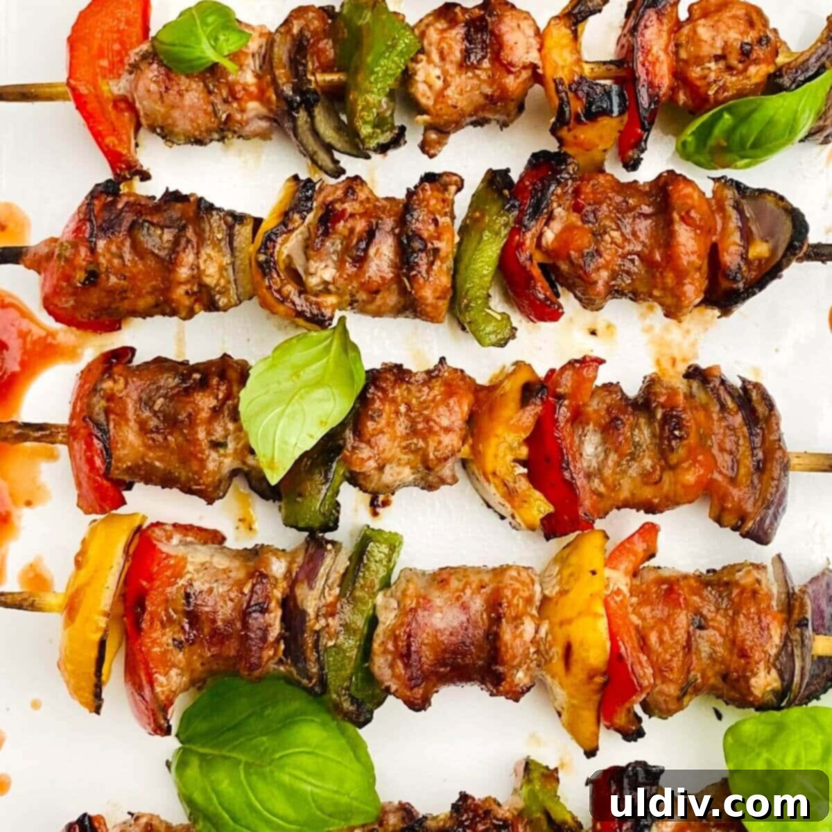 Grilled Italian Sausage & Veggie Skewers 2 Delicious platter of grilled Italian sausage kabobs with colorful bell peppers and red onions.