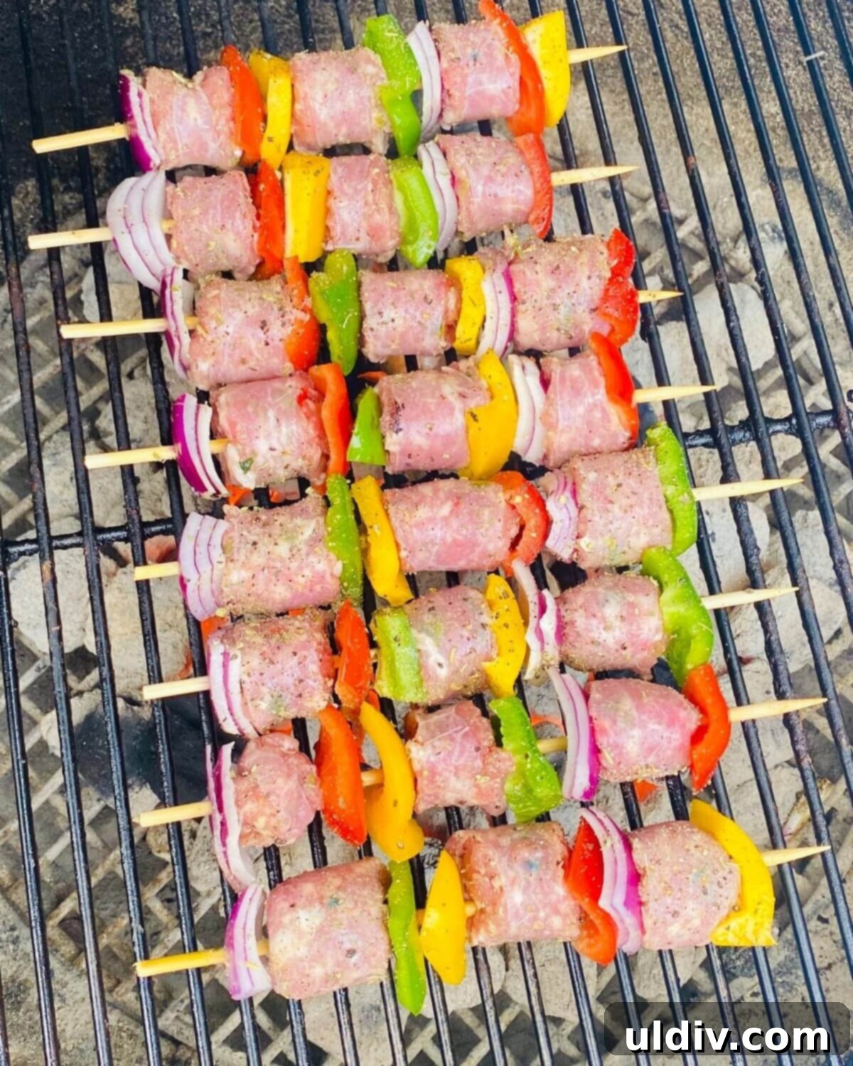 Grilled Italian Sausage & Veggie Skewers 7 Sausage kabobs grilling over a hot flame.