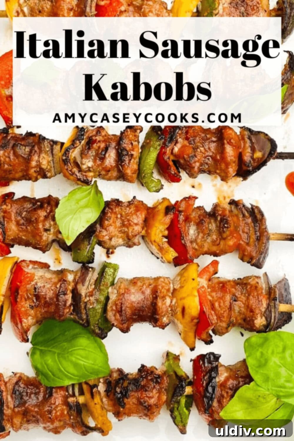 Grilled Italian Sausage & Veggie Skewers 10 A vibrant platter of freshly grilled sausage kabobs with basil garnish.