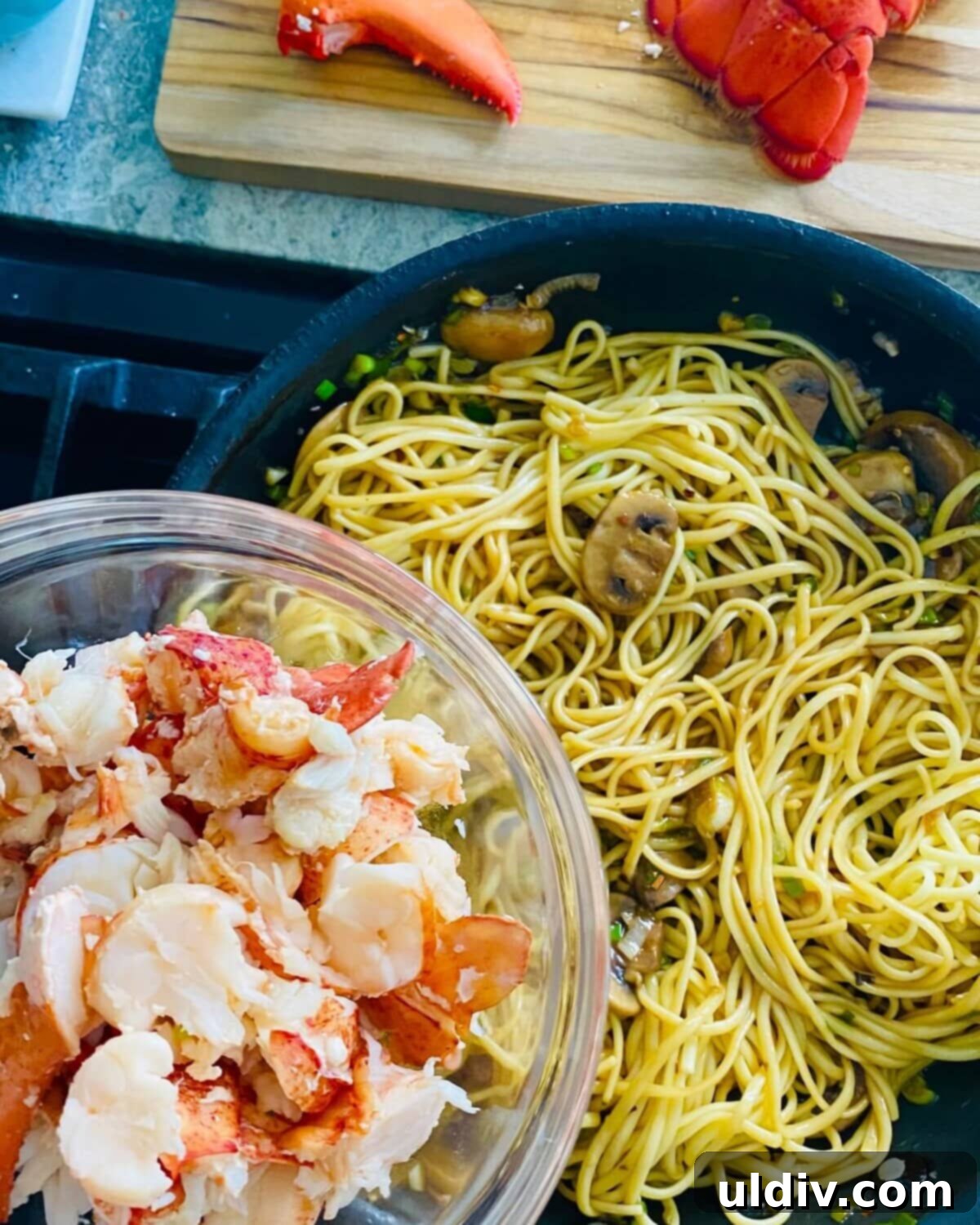 Decadent Garlic Lobster Noodles 11 Adding lobster to noodles.