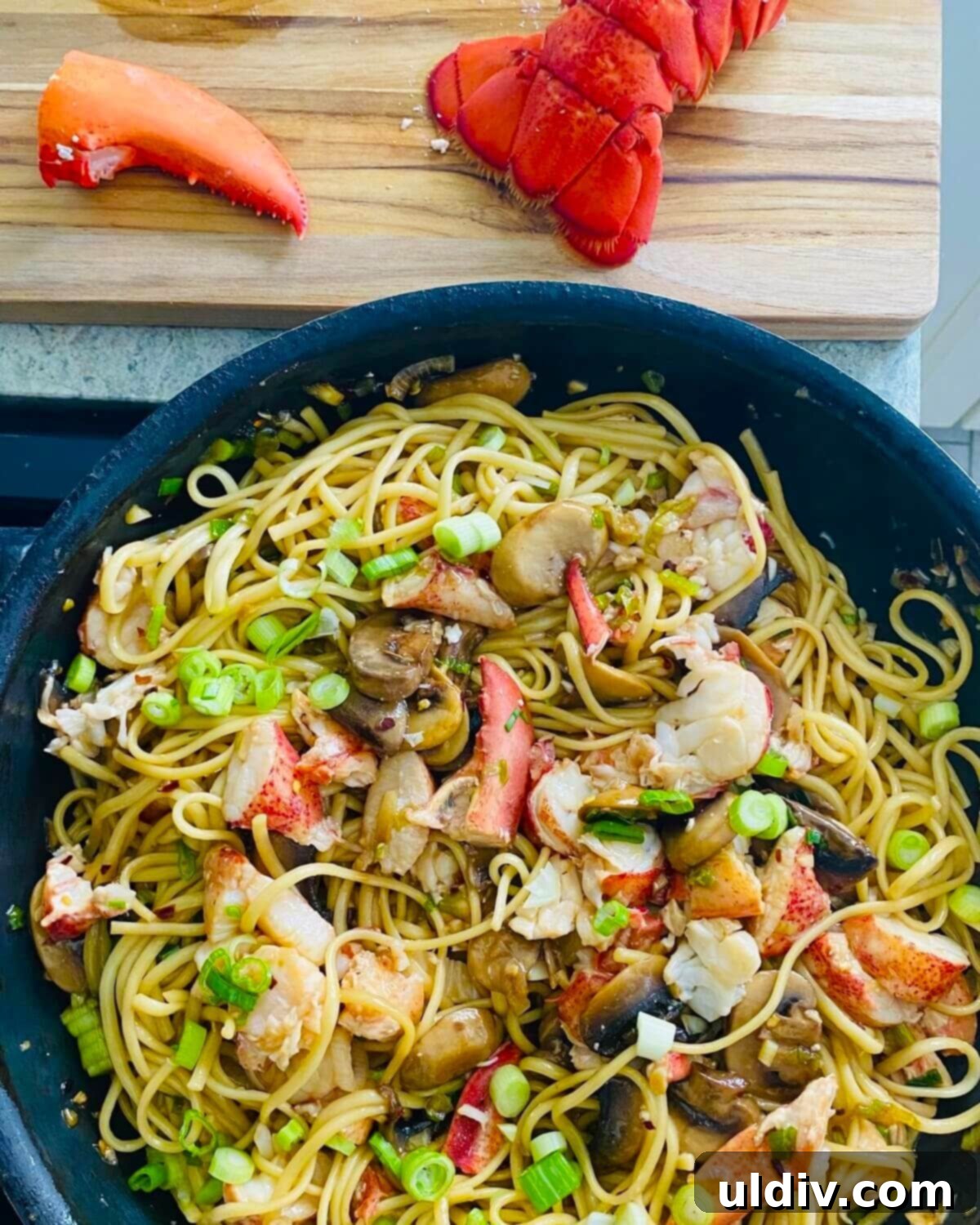 Decadent Garlic Lobster Noodles 10 lobster noodles on stovetop.