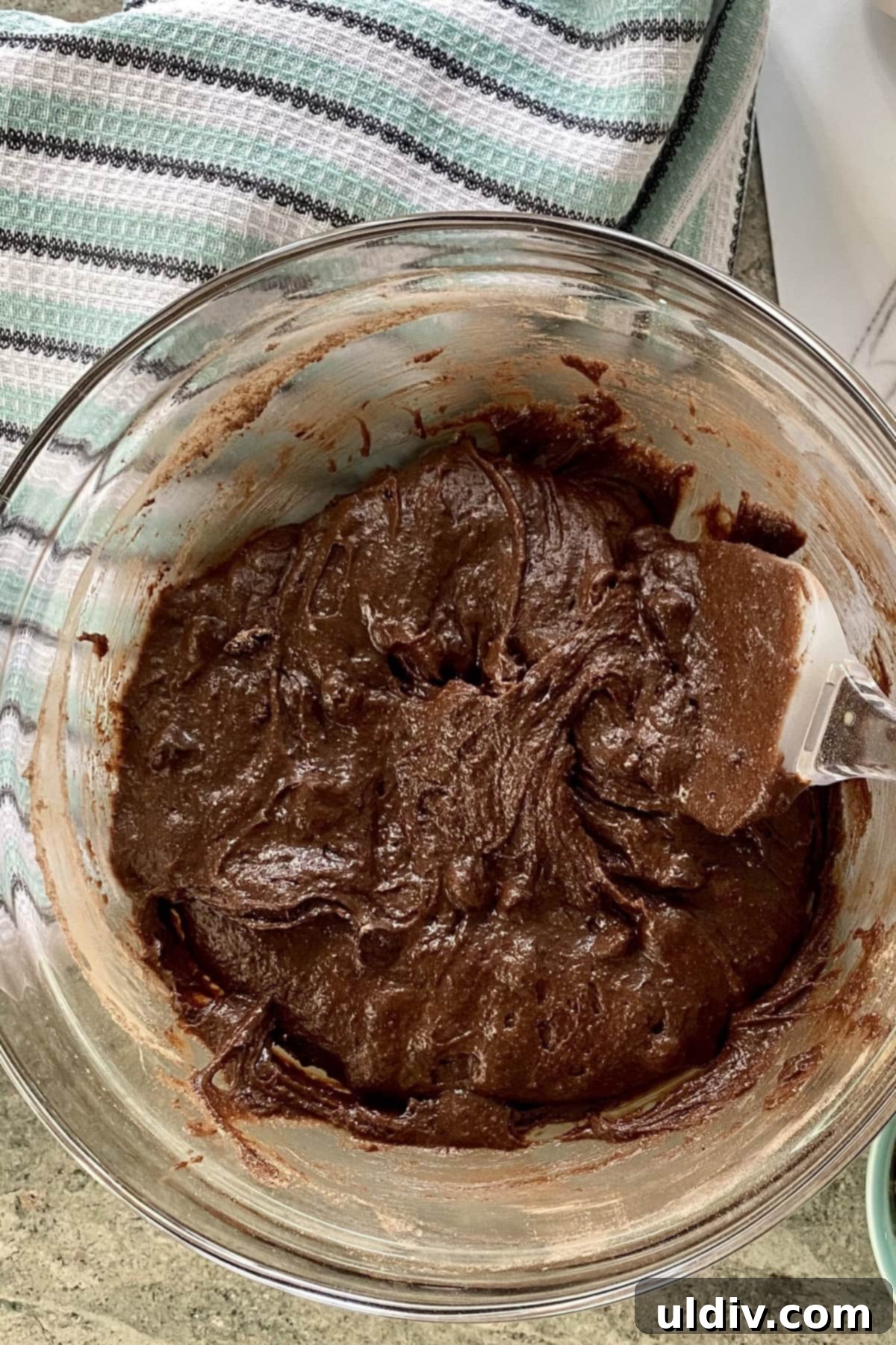 Fudgy Chocolate-Dipped Brownies with Fresh Strawberries 6 A large bowl containing glossy, rich chocolate brownie batter, ready for baking.