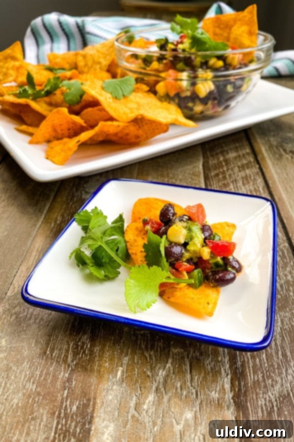 Avocado Bean Texas Caviar 4 Tex Mex bean dip with tortilla chips also known as Texas Caviar