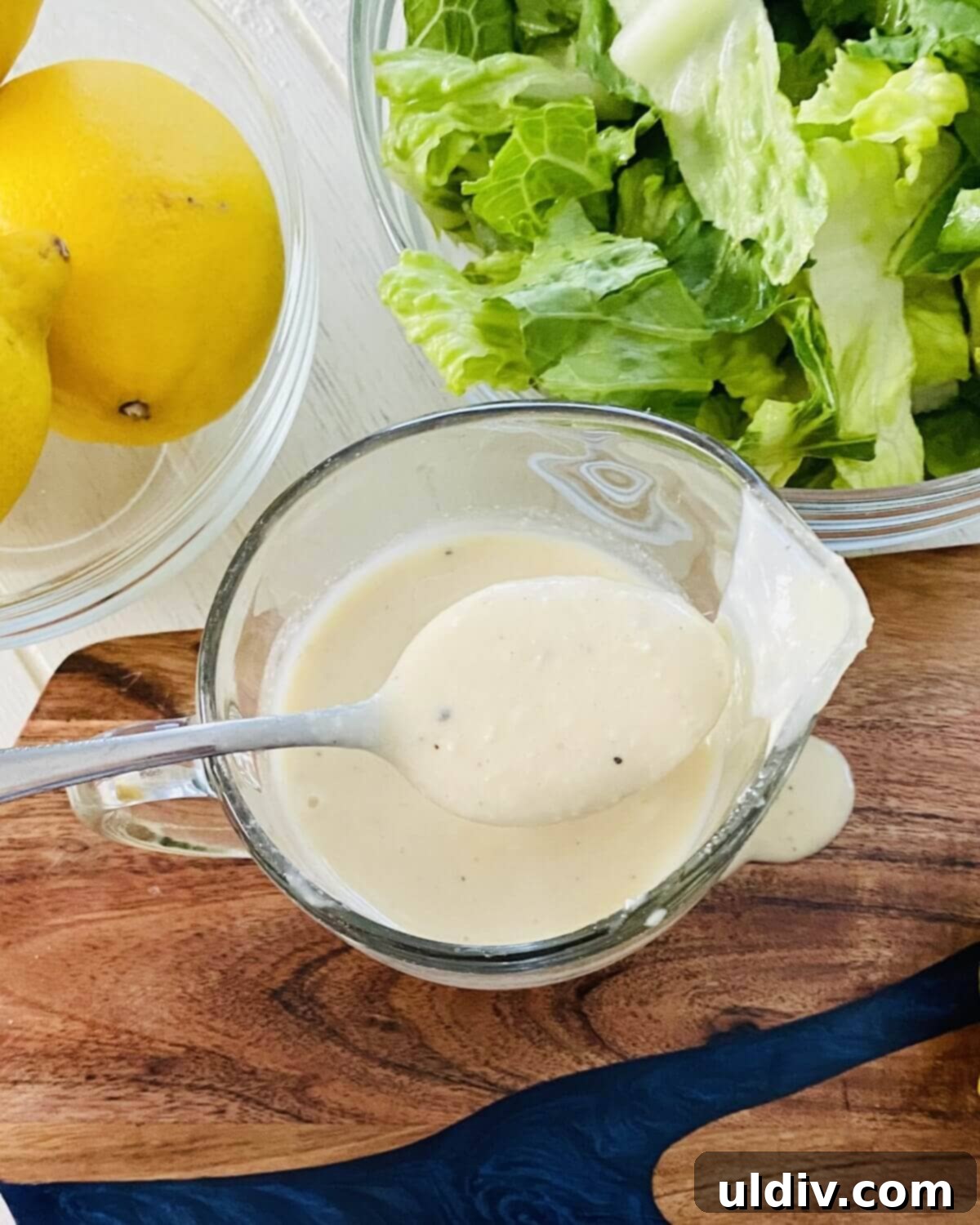 Anchovy-Free Homemade Caesar Dressing 2 spoon of Caesar dressing.
