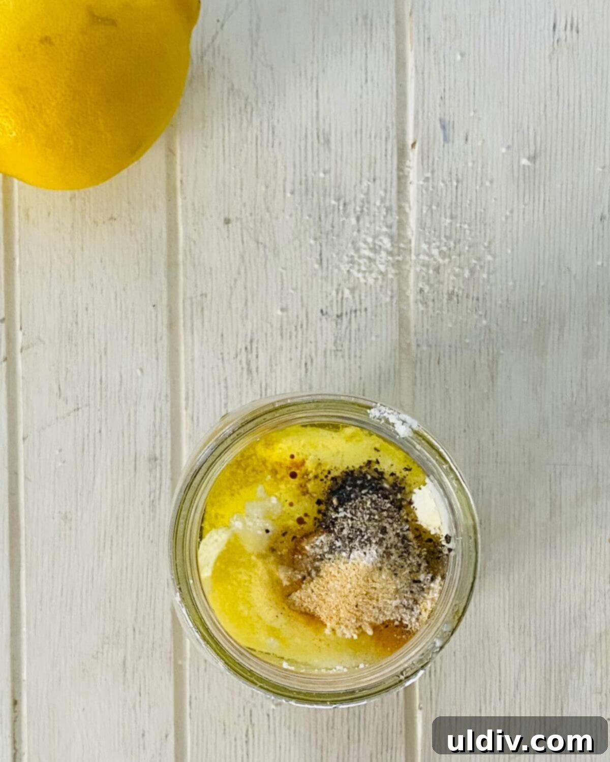 Anchovy-Free Homemade Caesar Dressing 6 ingredients for Caesar salad dressing without anchovies in a mason jar.