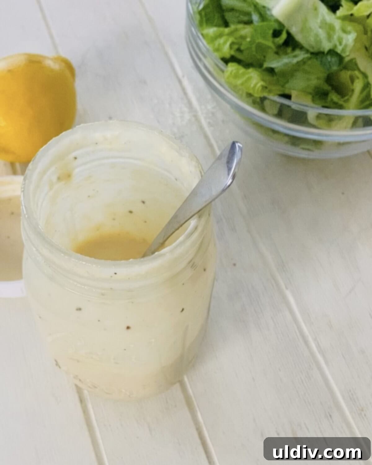 Anchovy-Free Homemade Caesar Dressing 9 open jar of Caesar dressing.