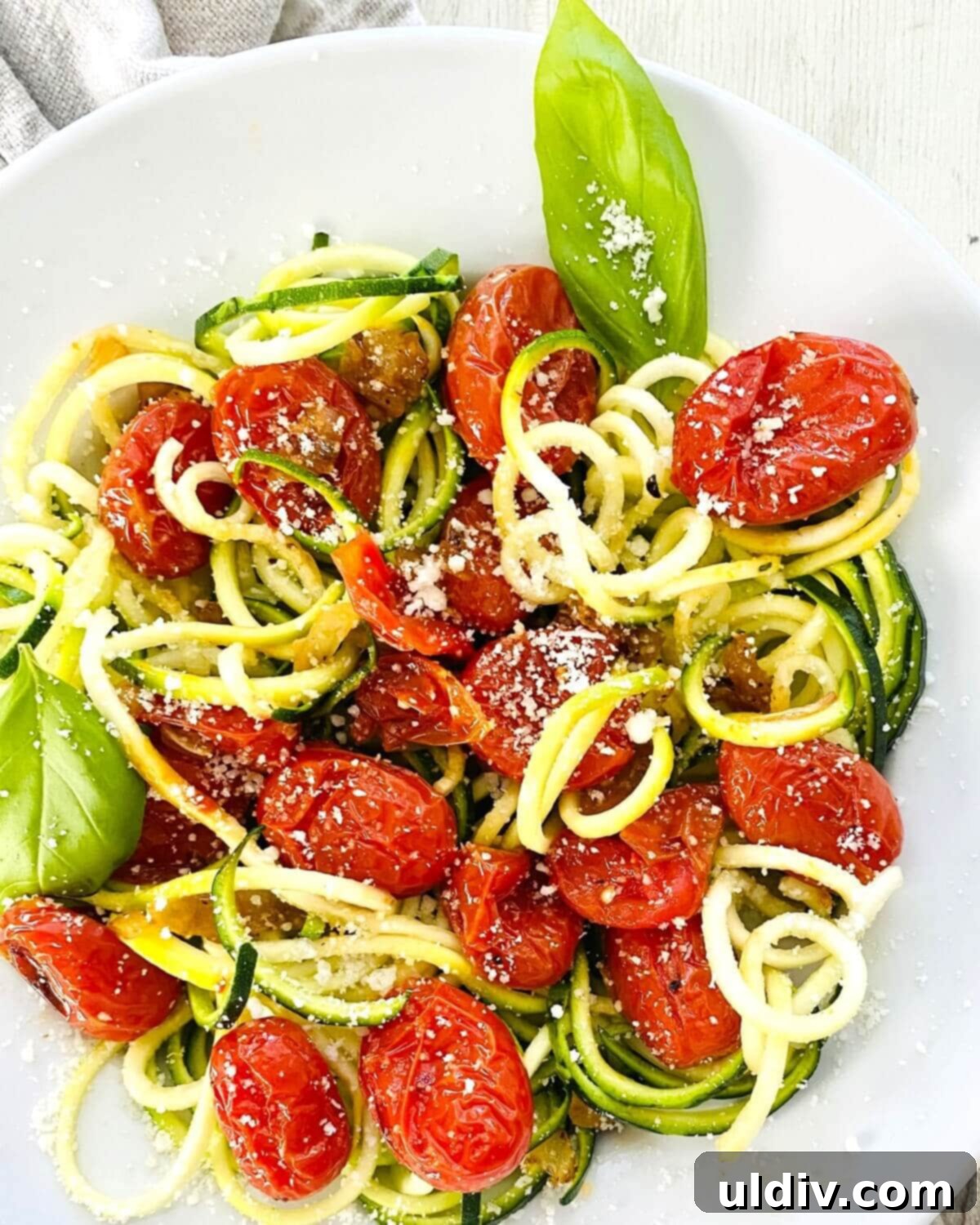 Oven-Kissed Cherry Tomato Pasta 9 oven roasted cherry tomato sauce with zucchini noodles.