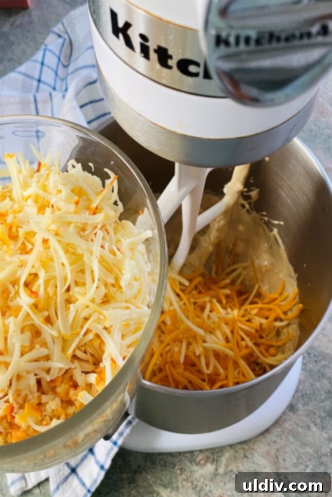 Creamy Pimento Perfection 5 adding shredded cheese to mixer