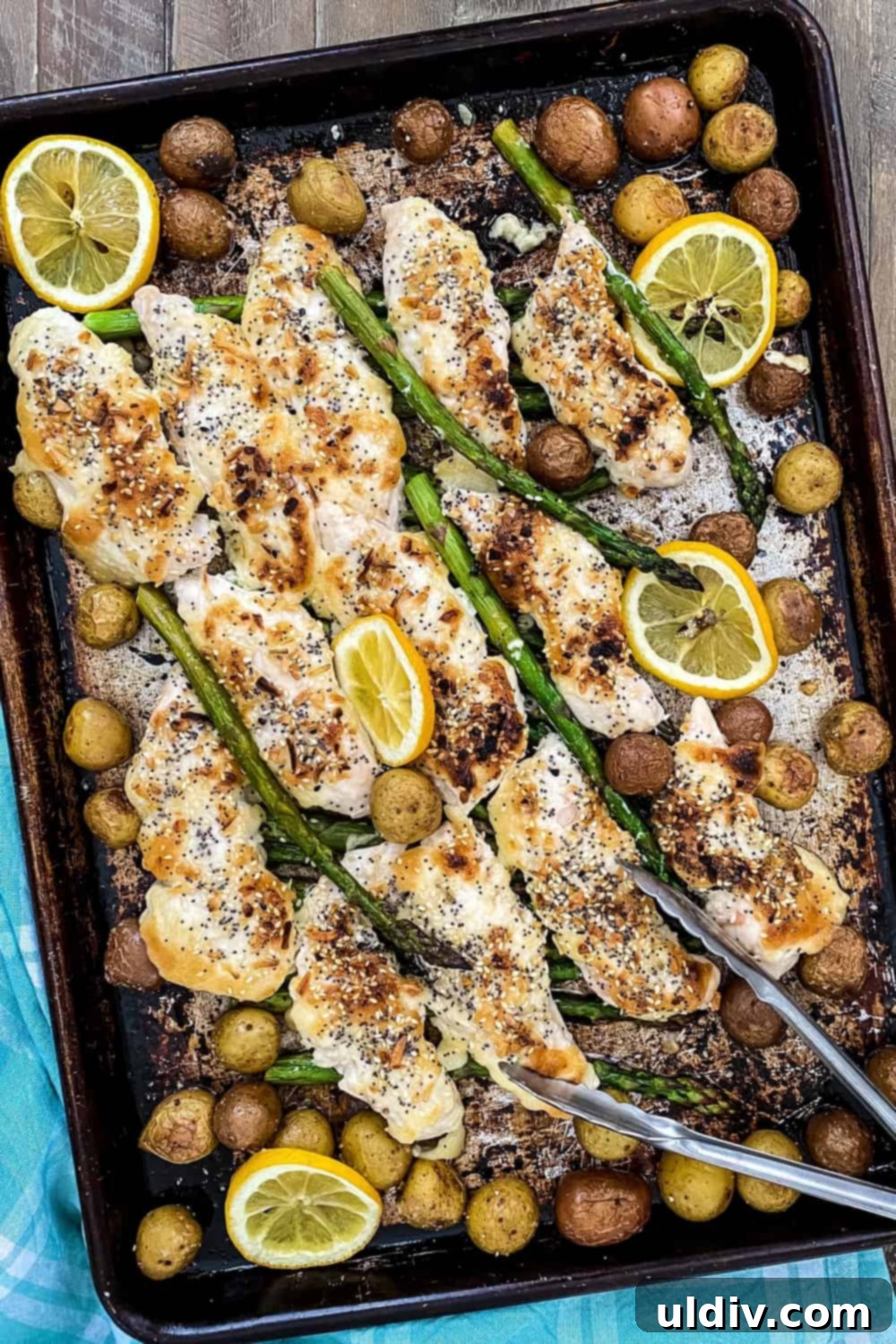 Easy Everything Bagel Chicken Bake 2 sheet pan dinner with chicken, potatoes, and asparagus with everything bagel seasoning