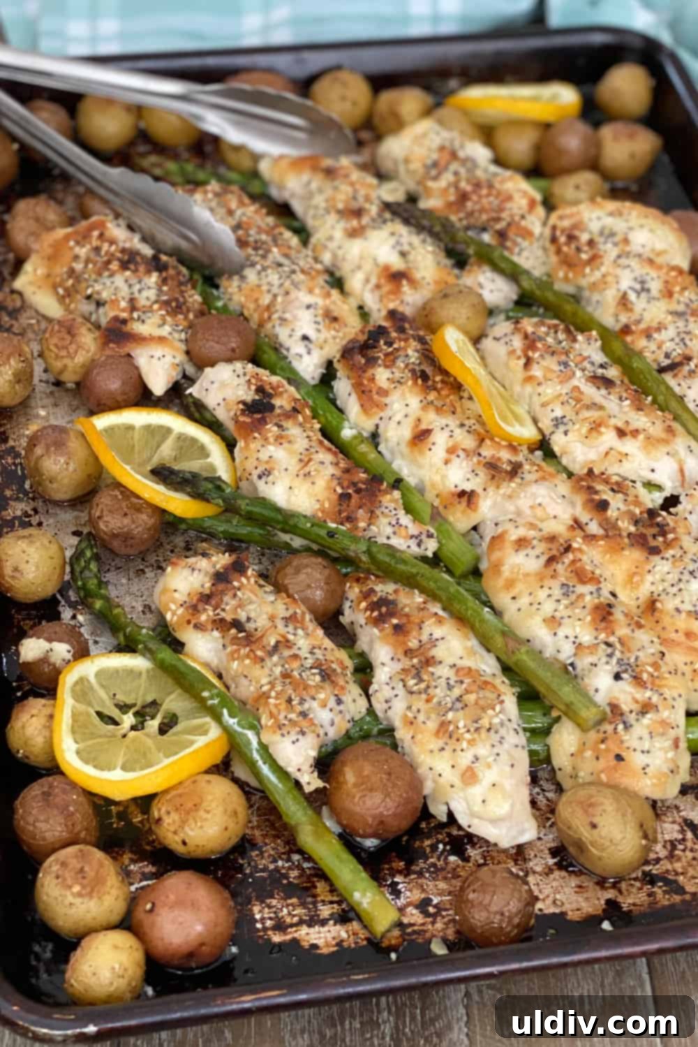 Easy Everything Bagel Chicken Bake 3 sheet pan chicken dinner with roasted potatoes, asparagus and everything bagel seasoning