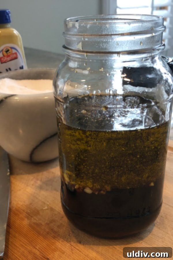 Zesty Balsamic Steak Marinade 2 A beautifully arranged mason jar showcasing the fresh ingredients for a flavorful balsamic steak marinade, ready to be mixed.