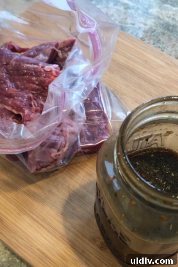 Steak's Balsamic Secret 3 A marinating steak in a resealable bag on a cutting board.
