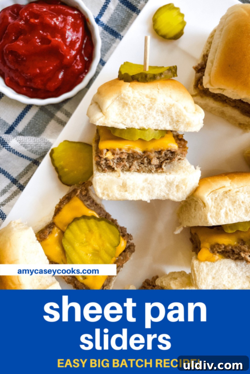 Ultimate Crowd-Pleasing Cheeseburger Sliders 15 Platter of cheeseburger sliders garnished with dill pickles, perfect for a gathering.
