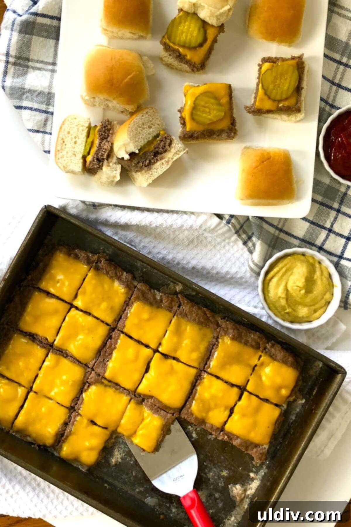 Ultimate Crowd-Pleasing Cheeseburger Sliders 10 Assembling cheeseburger sliders on mini rolls with dill pickle chips, ketchup, and mustard.