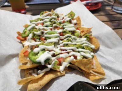 Chicago's Tatas Tacos: An Unmissable Flavor Journey 5 A large platter of Tatas Tacos Nachos, generously topped with fresh ingredients.