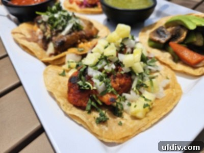 Chicago's Tatas Tacos: An Unmissable Flavor Journey 7 Close-up of a variety of tacos from the flight at Tatas Tacos, showing detailed toppings.