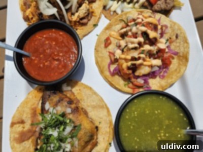 Chicago's Tatas Tacos: An Unmissable Flavor Journey 8 Another angle of the taco flight, highlighting the diverse fillings and vibrant salsas.