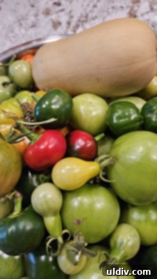 Easy Pickled Hot Peppers 18 An array of green tomatoes on a kitchen counter, ready for cooking