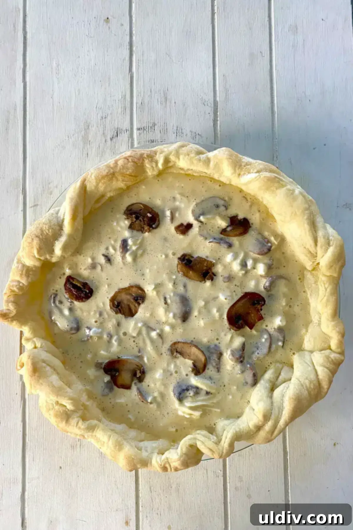 Golden Flaky Mushroom Quiche 9 a parbaked puff pastry crust filled with mushroom quiche filling.