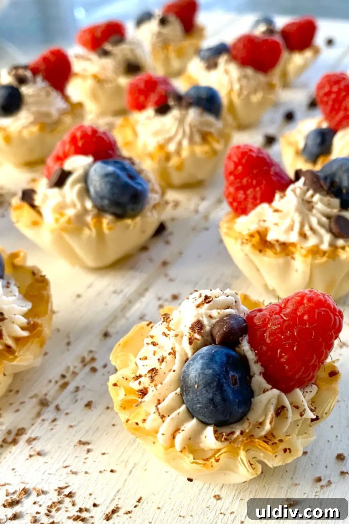 Simple Philadelphia No-Bake Cheesecake Bites 2 Mini Philadelphia no bake cheesecake recipe served in phyllo cups and topped with berries.