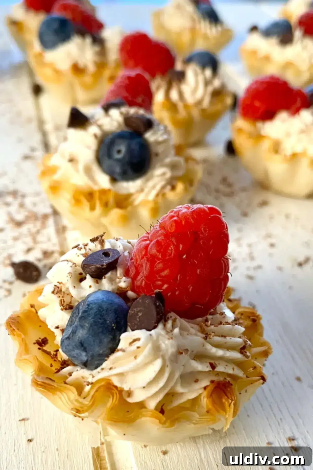 Simple Philadelphia No-Bake Cheesecake Bites 12 1 mini Philadelphia cheesecake topped with berries.