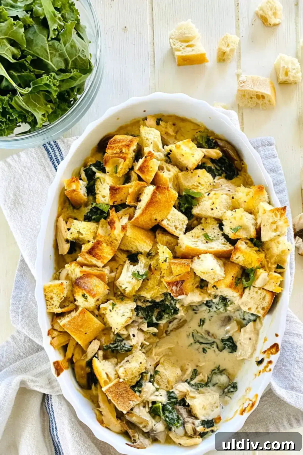 Comforting Creamy Chicken and Kale Casserole 2 A delicious serving of Creamy Chicken and Kale Casserole, with a portion already enjoyed.