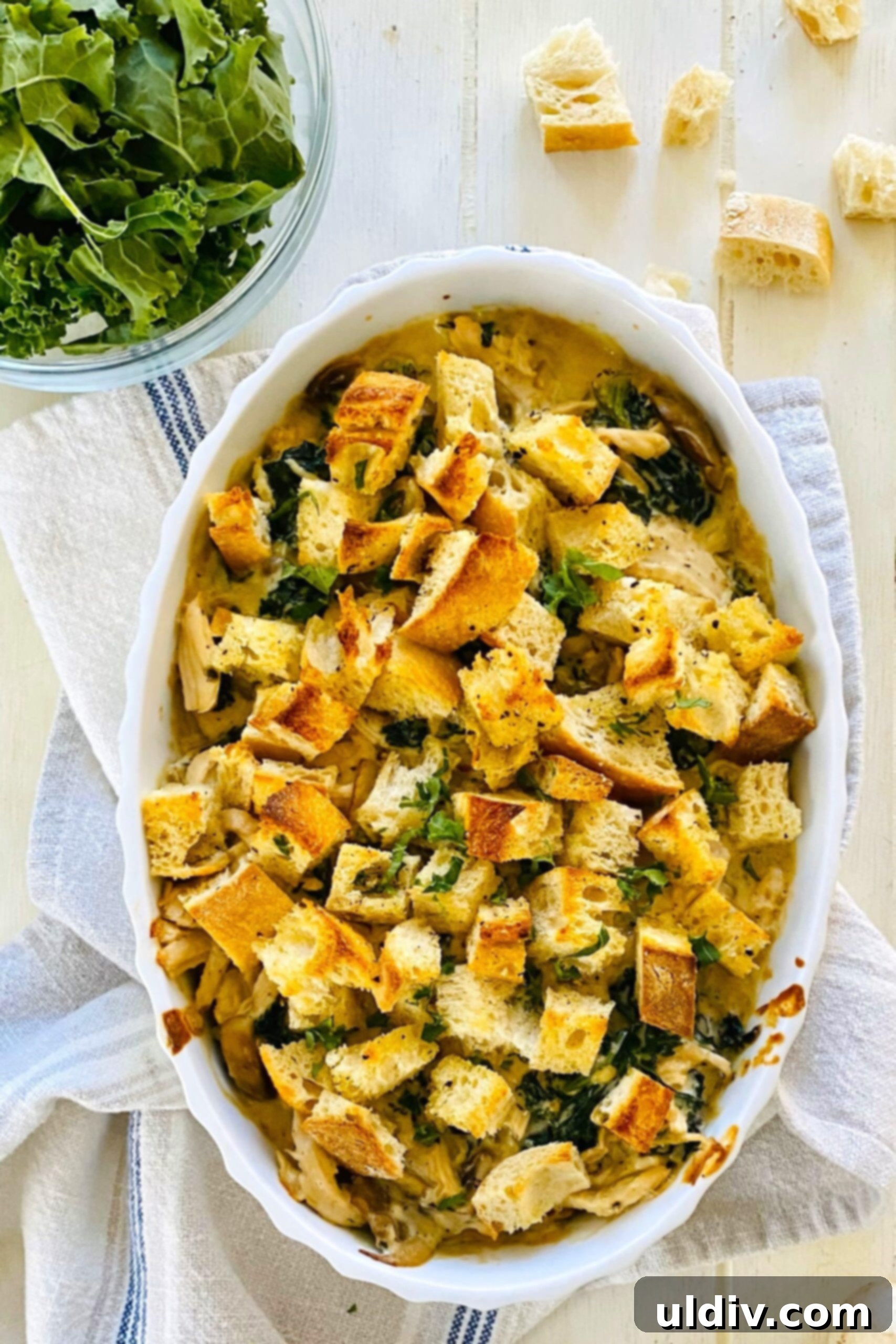 Comforting Creamy Chicken and Kale Casserole 12 The golden-brown, baked chicken and kale casserole, bubbling hot from the oven.