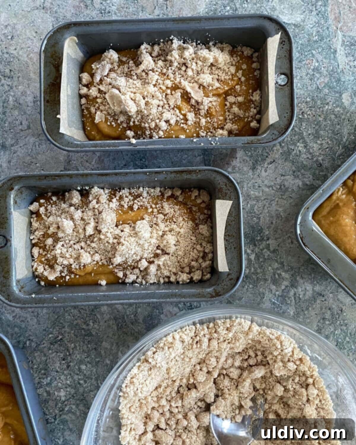 Cozy Autumn Mini Pumpkin Loaves 6 Close-up of the streusel topping mixture in a bowl, showing its crumbly texture.
