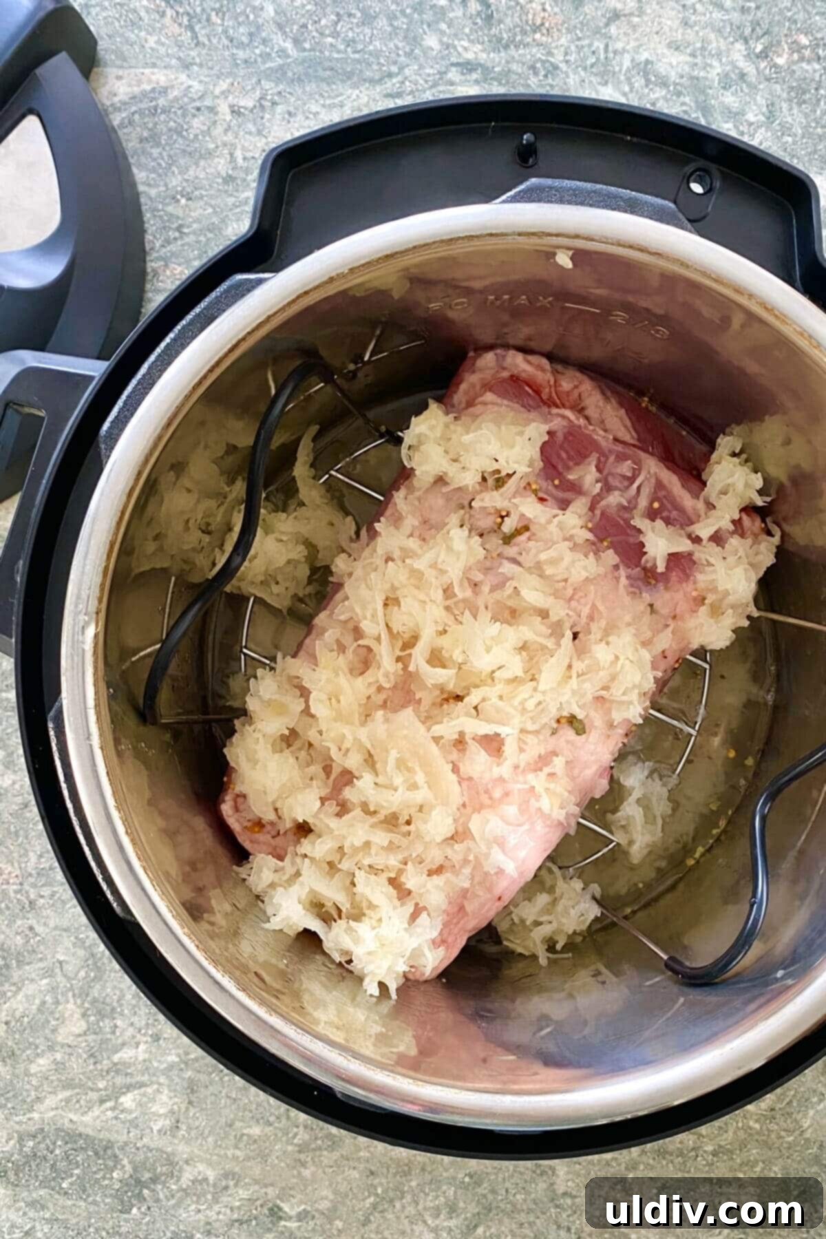 Perfectly Tender Instant Pot Corned Beef and Cabbage 5 Corned beef and sauerkraut in an Instant Pot.