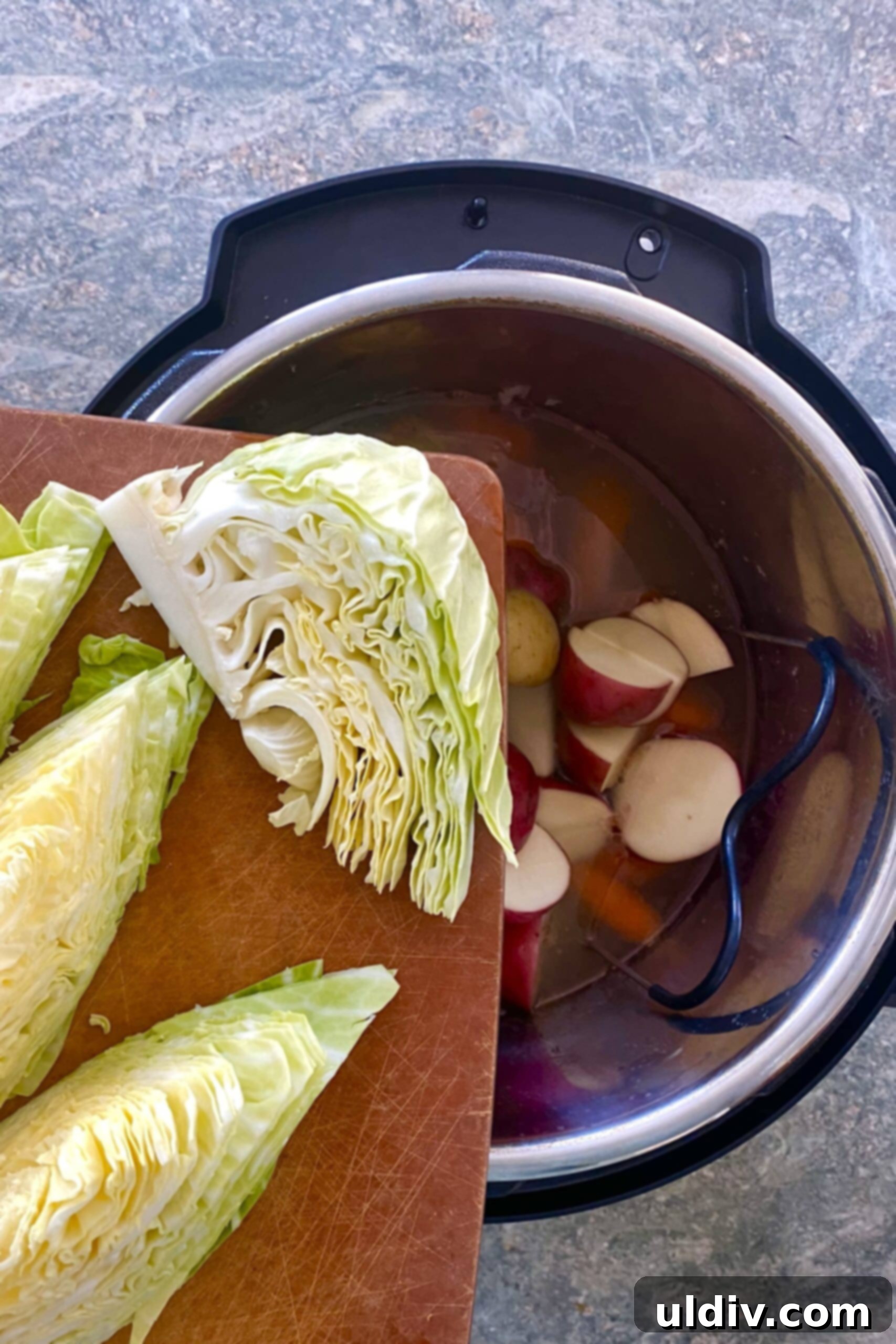 Perfectly Tender Instant Pot Corned Beef and Cabbage 8 Adding cabbage wedges to Instant Pot for corned beef.