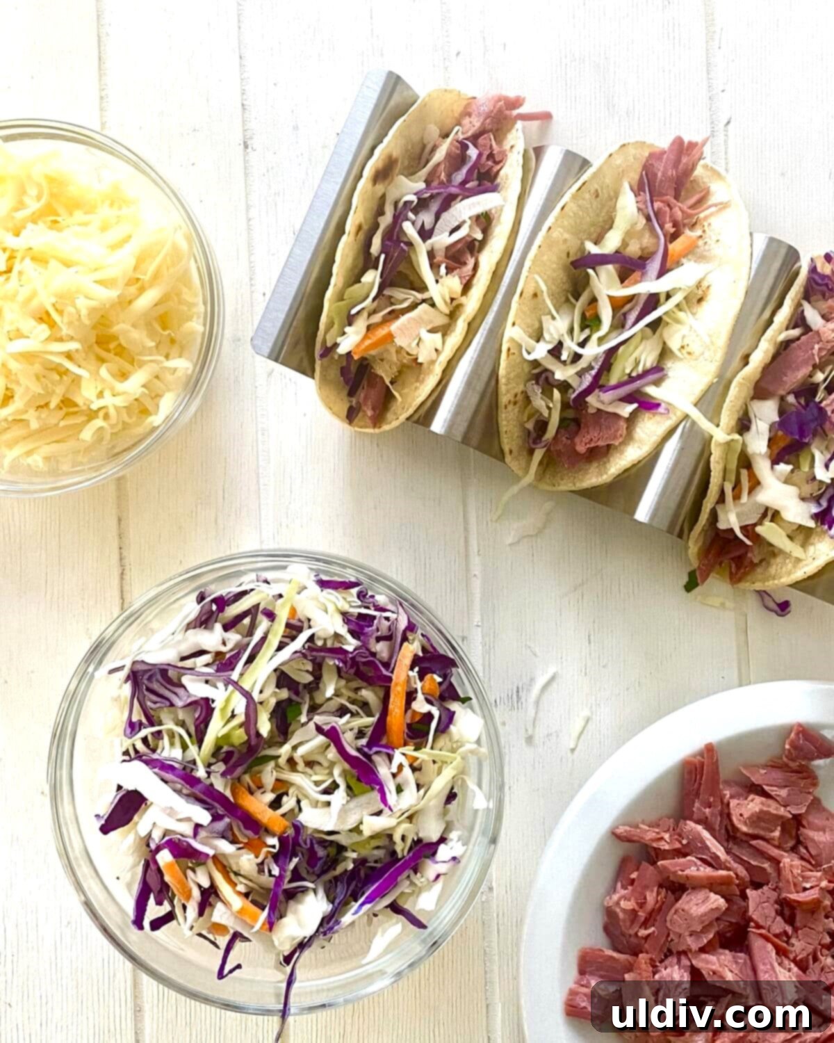 Irish Tacos: The Corned Beef & Cabbage Twist 7 Assembling an Irish taco: shredded corned beef, sauerkraut, and cabbage being added to a warm tortilla.