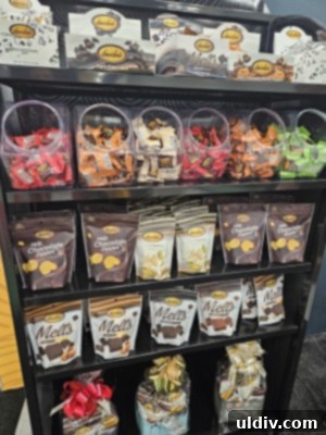 Unwrapping the 2025 Sweets & Snacks Expo 18 A vibrant display of Bedré chocolates, showcasing their premium packaging and tempting varieties.