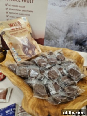Unwrapping the 2025 Sweets & Snacks Expo 19 An inviting booth display for Wild West Chocolates, featuring a variety of their uniquely crafted chocolate products.