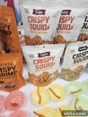A vibrant display of various South Korean snacks, showcasing unique packaging and flavors, at the Sweets & Snacks Expo.
