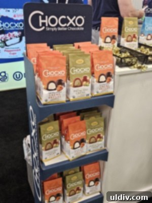 Unwrapping the 2025 Sweets & Snacks Expo 23 A display of Chocxo Chocolate products, emphasizing their commitment to quality and thoughtful indulgence.