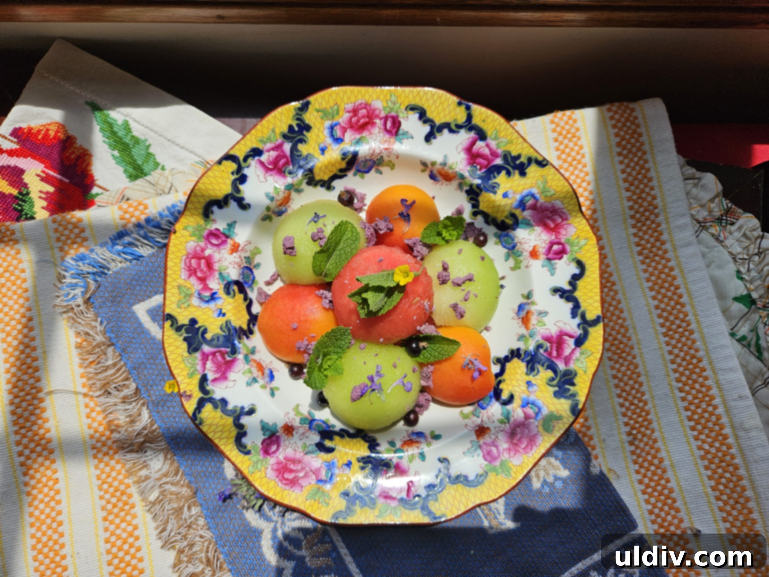 Melon Magic for Solstice 2025 2 A vibrant fruit salad featuring melons, apricots, and berries, ready to be enjoyed on a warm summer day.