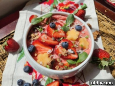 Serving Up Wimbledon's Best Bites 2025 4 Vibrant strawberry smoothie bowl with granola, fresh berries, and cantaloupe