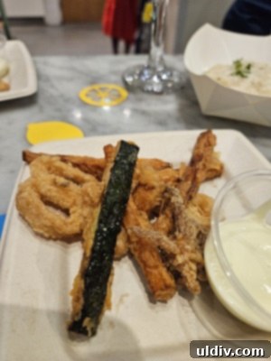Eataly 2025 Summer Saturdays Collection 4 Crispy Fritto Misto with assorted seafood and vegetables, garnished with lemon