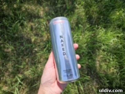 The Naked Truth About Sparkling Energy 4 Naked Sparkling Energy cans and a glass of the drink with lemon slices