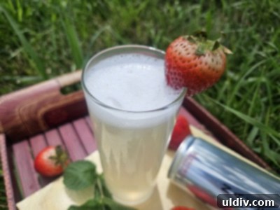 The Naked Truth About Sparkling Energy 6 A glass of Naked Sparkling Energy with lemon and mint, beside a can