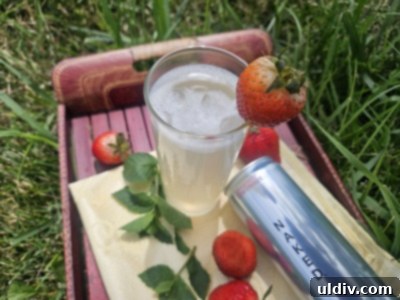 The Naked Truth About Sparkling Energy 7 A refreshing glass of Naked Sparkling Energy with strawberries and mint leaves on ice