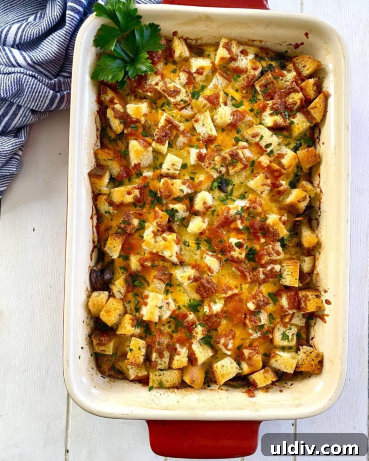 Sausage, Mushroom & Spinach Breakfast Strata 13 The baked egg casserole with golden brown croutons and a set, fluffy interior, fresh out of the oven.
