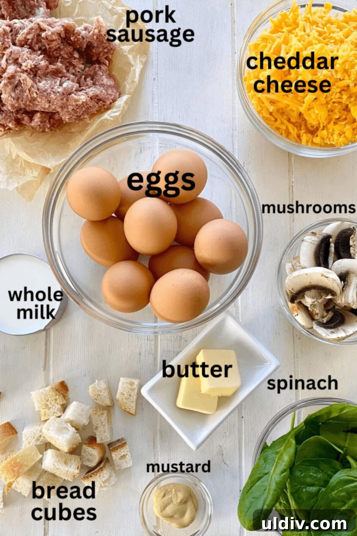 Loaded Breakfast Egg Bake with Sausage, Spinach, Mushrooms, and Croutons 4 breakfast sausage, eggs, cheese, milk, mushrooms, butter, bread cubes, mustard, spinach.
