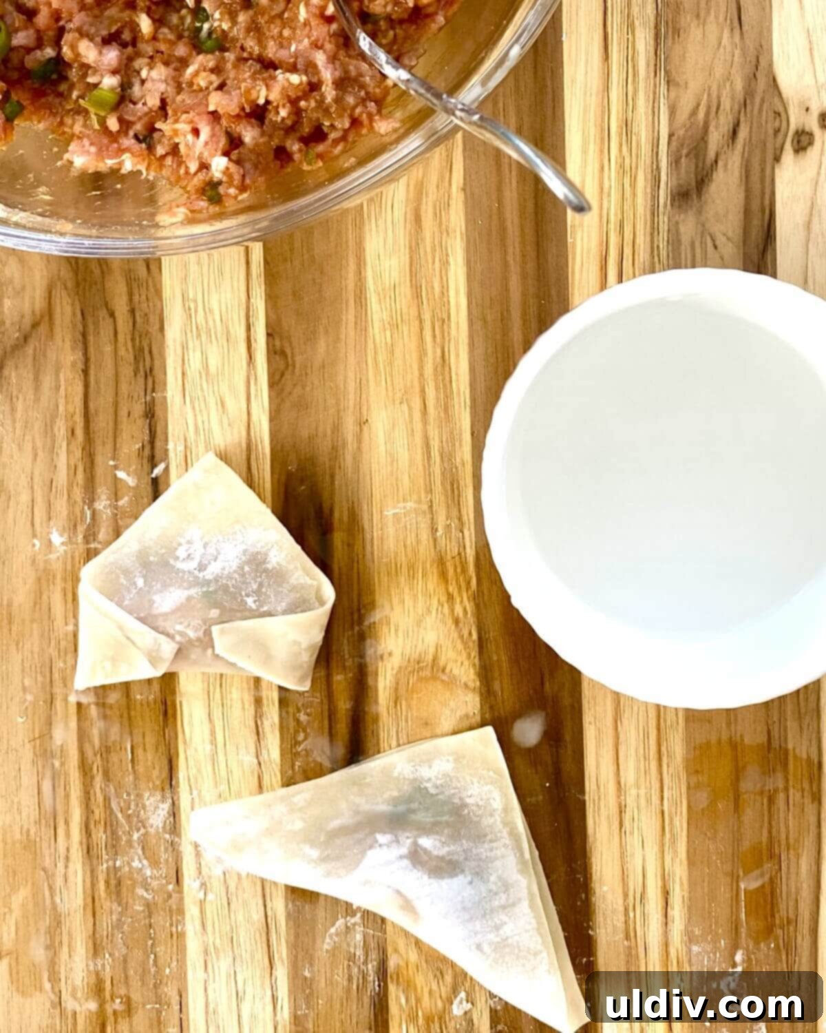 Irresistible Pork Potstickers with Signature Dipping Sauce 9 Finished uncooked potstickers.