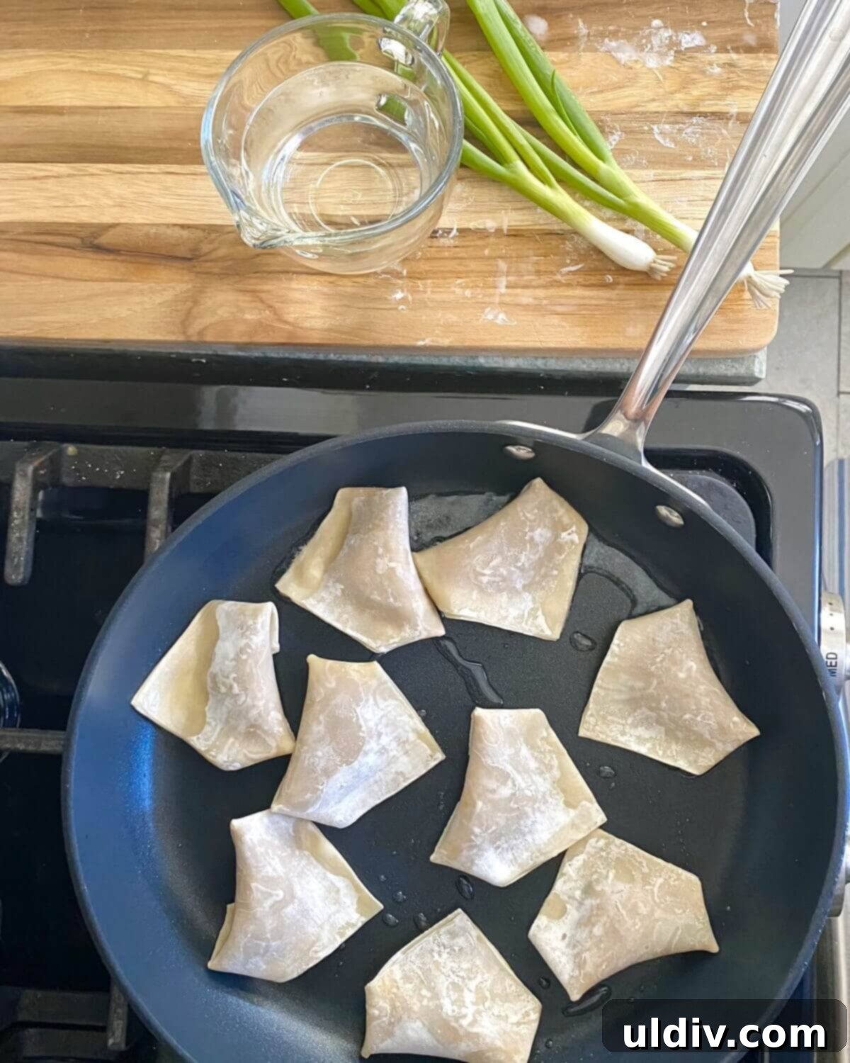Irresistible Pork Potstickers with Signature Dipping Sauce 10 Pan frying pork potstickers.