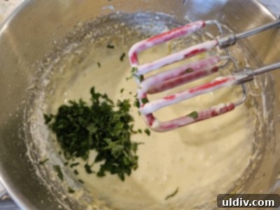 Sunshine Lemon Balm Bundt Cake 4 Finely chopped fresh lemon balm leaves arranged neatly on a cutting board, ready to be incorporated into a baking mixture