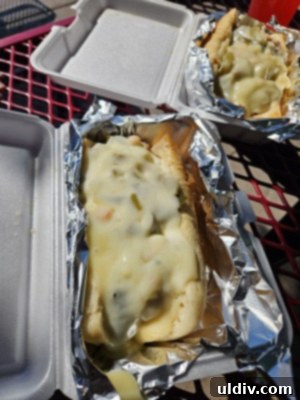 Variety of festive fall foods and beverages available at Sonny Acres Farm, including roasted corn and apple cider