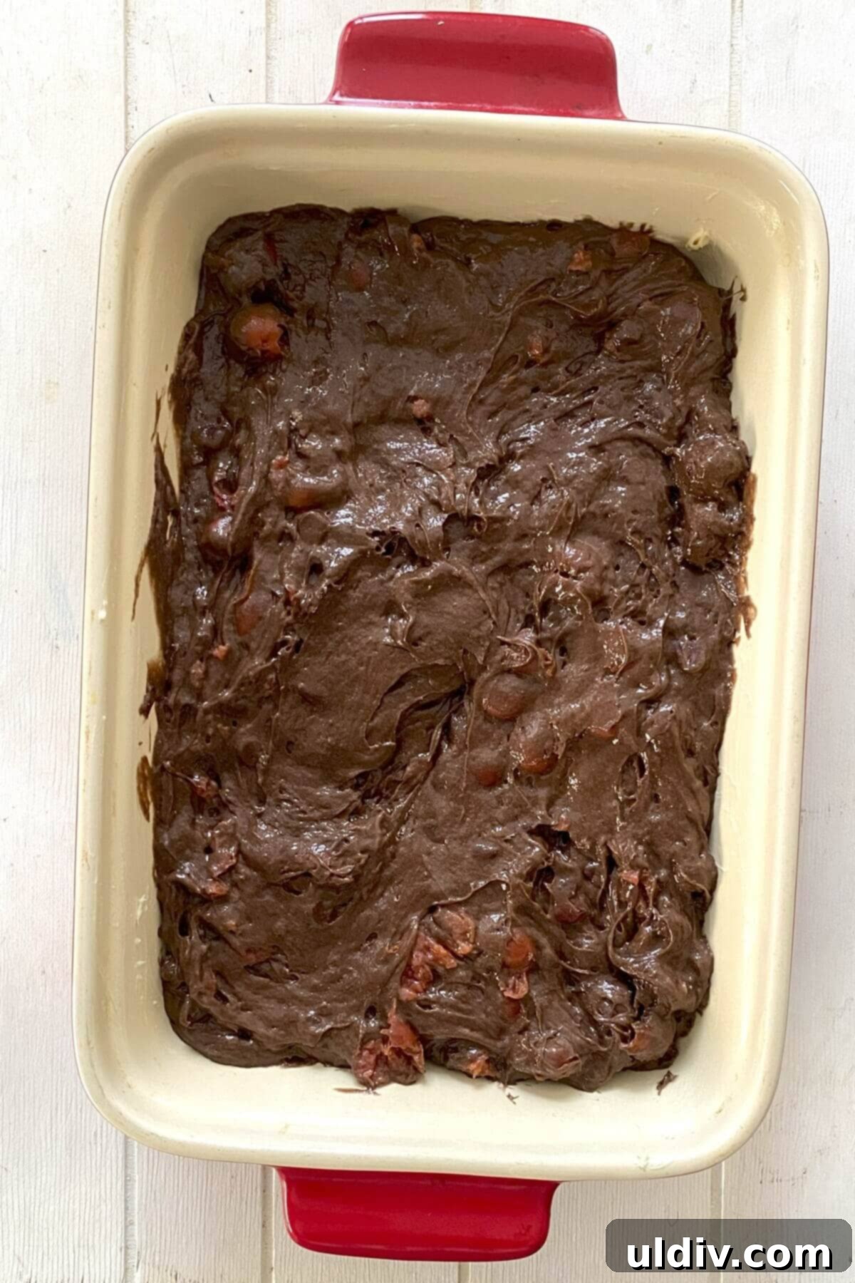 The cake batter in a baking pan.