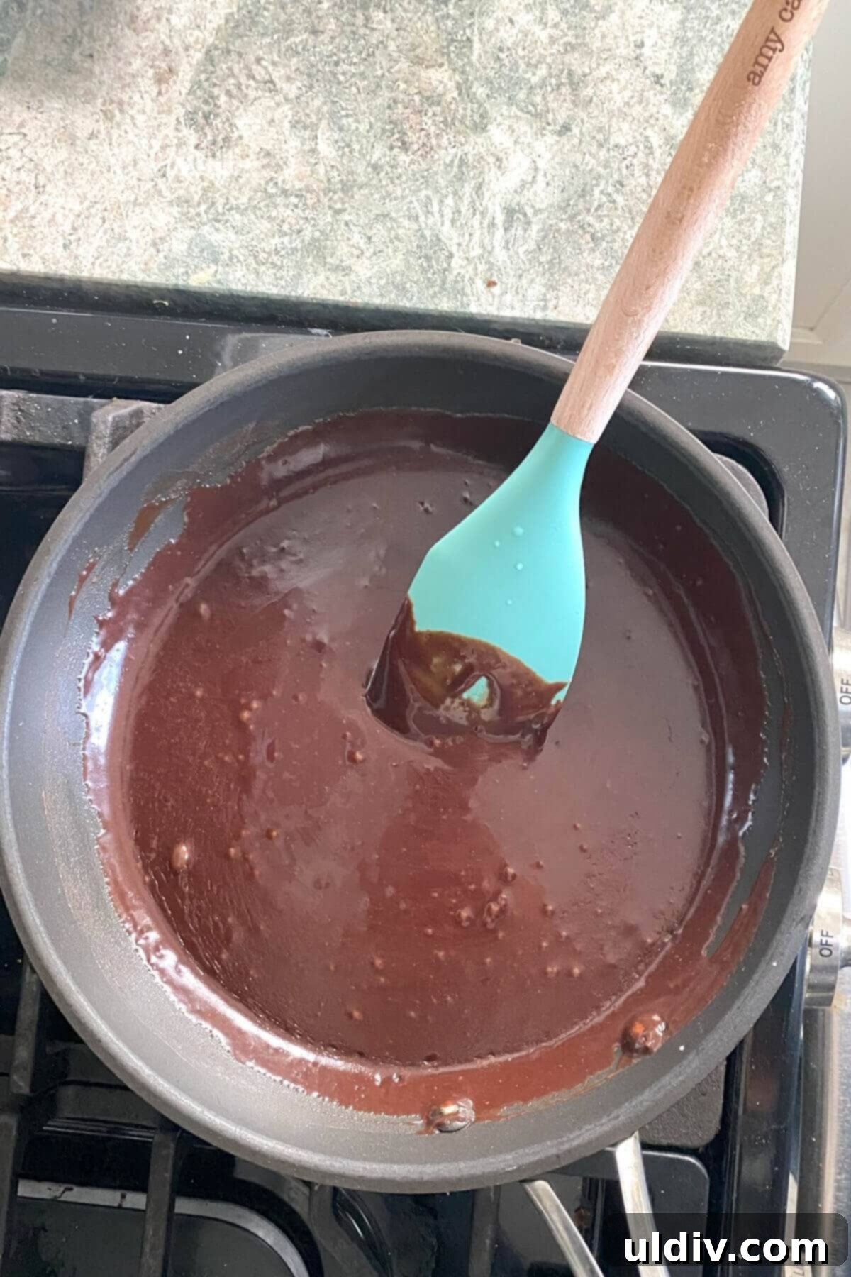 Chocolate icing in a saucepan.
